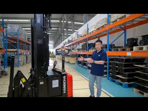 A Series Walkie Reach Stacker operating in a warehouse